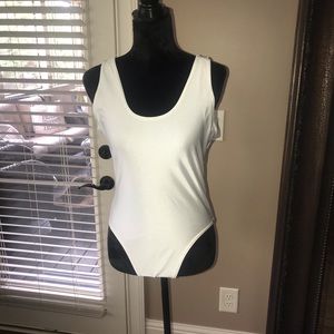 Cream swimsuit. Ask about adding personalization.